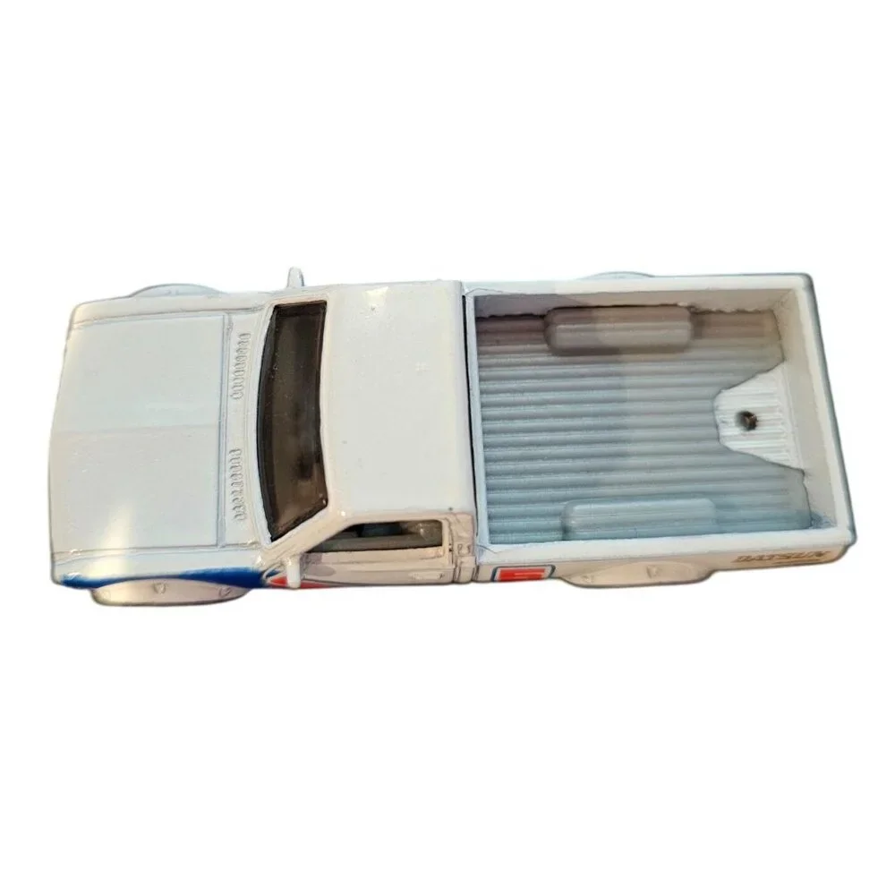 Hot Wheels Datsun 620 Die-Cast Pickup Truck Toy Model White Racing Stripes 2013